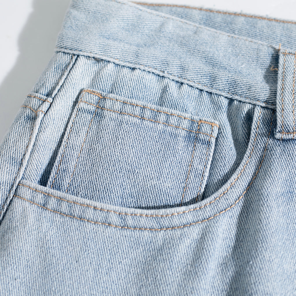 Light Wash Ripped Curved Leg Jeans