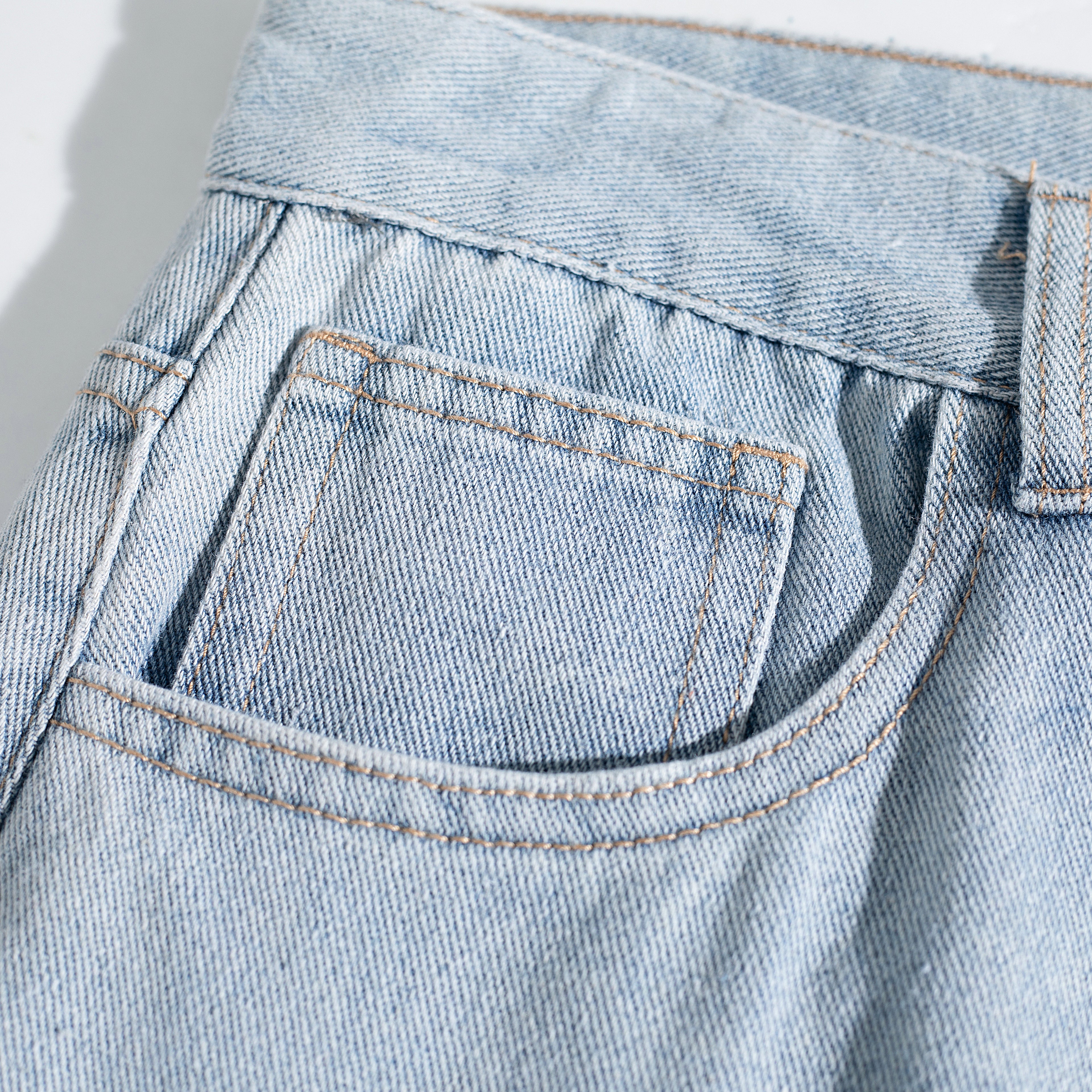 Light Wash Ripped Curved Leg Jeans