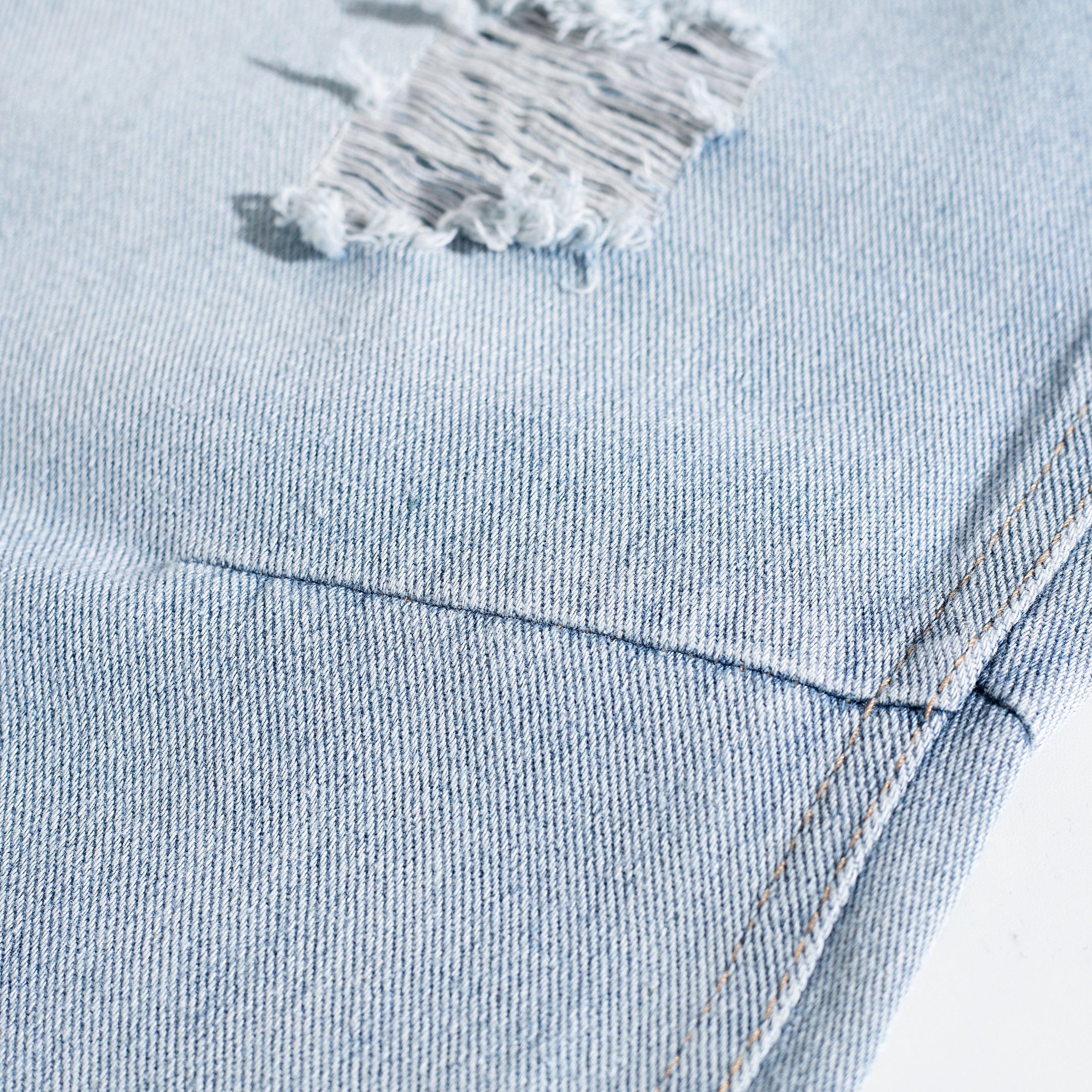 Light Wash Ripped Curved Leg Jeans