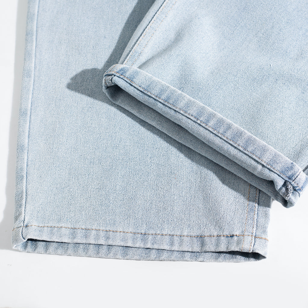Light Wash Ripped Curved Leg Jeans
