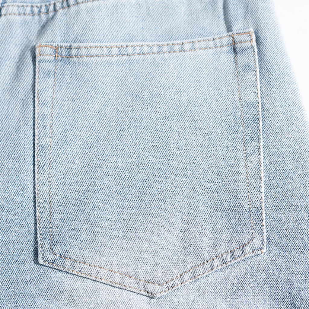 Light Wash Ripped Curved Leg Jeans