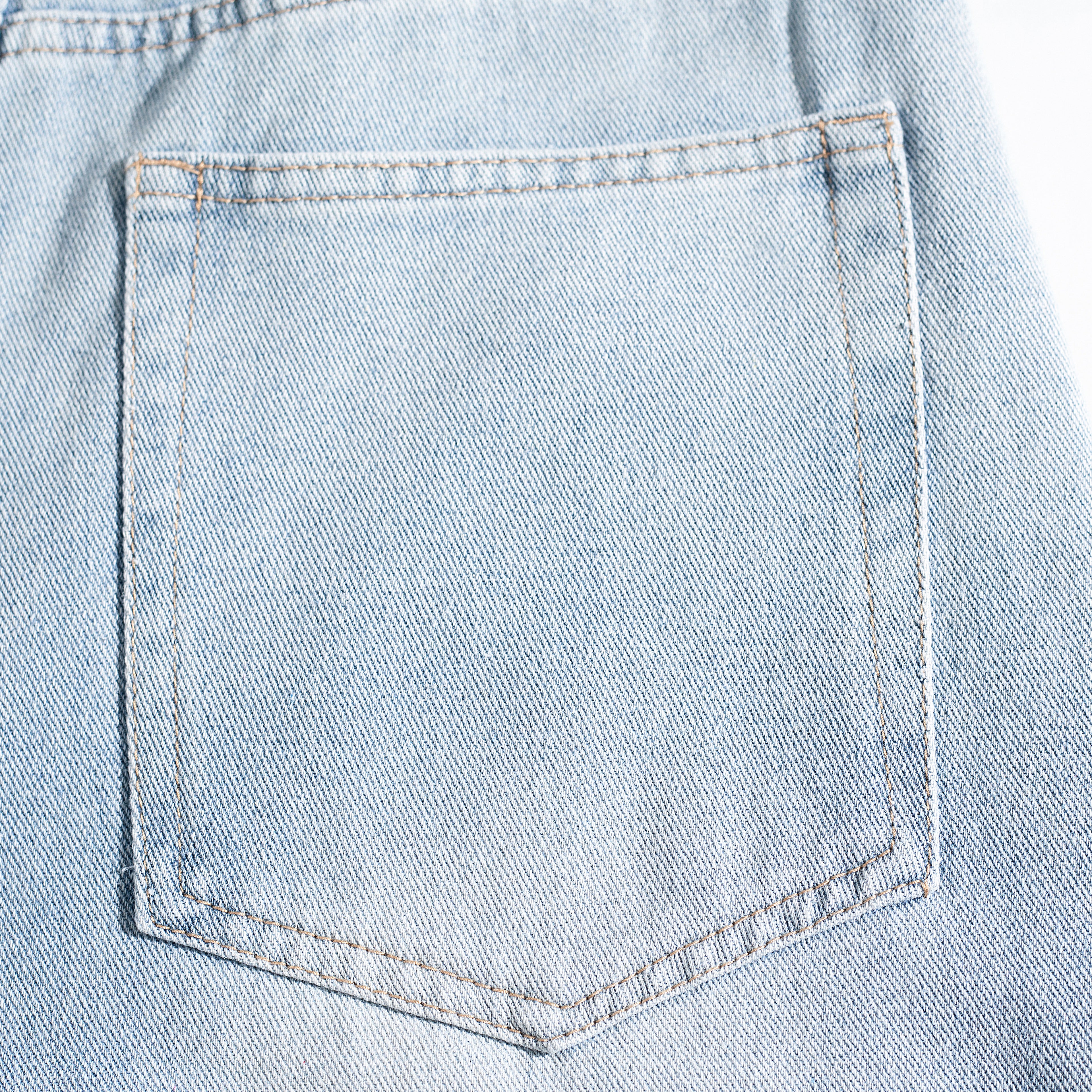 Light Wash Ripped Curved Leg Jeans