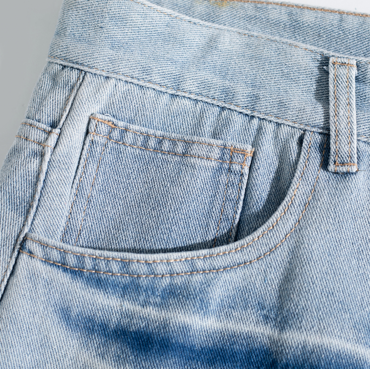 Light Wash Brush Mark Ripped Curved Jeans